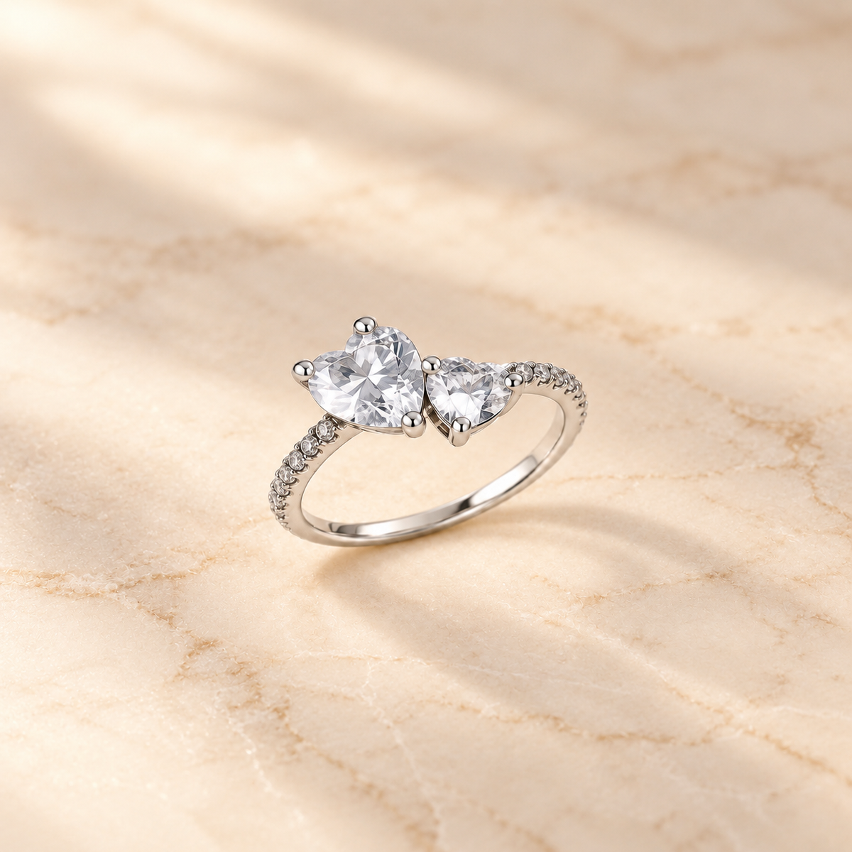 Crystal Twin Heart Ring on beige background