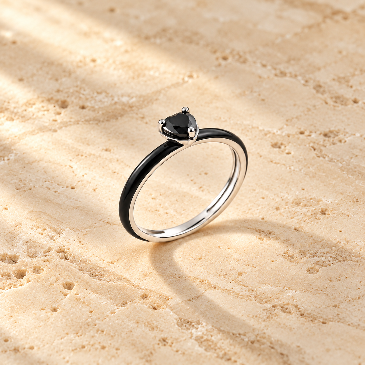 Black Enamel Heart Ring on beige background