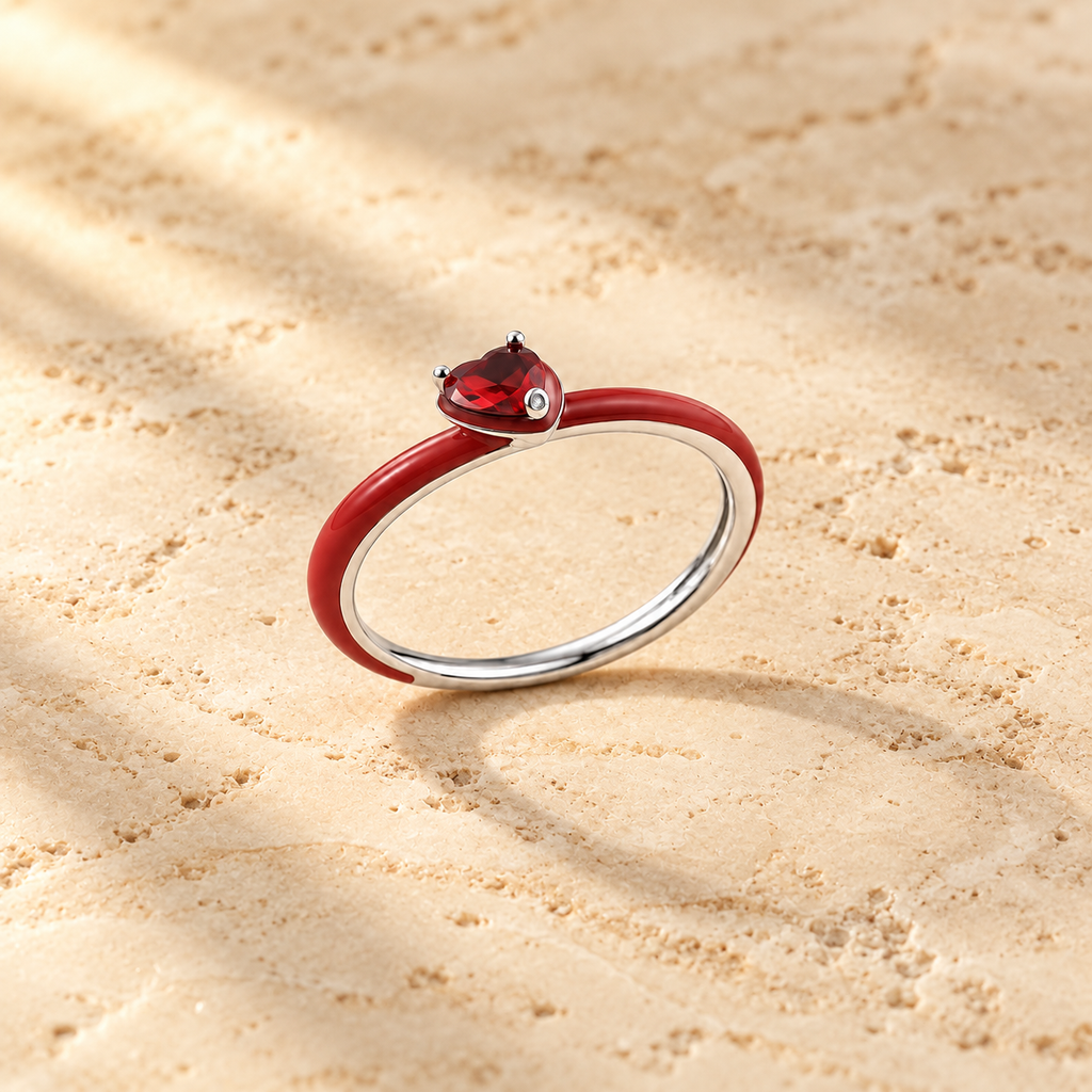 Red Enamel Heart Ring on beige background