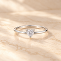 Heart Solitaire Ring on beige background