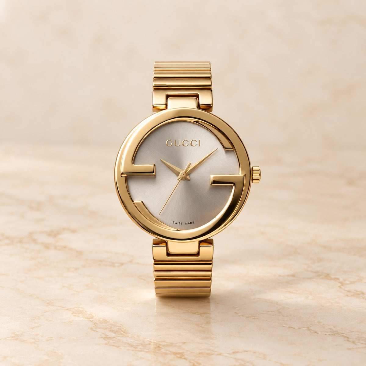 Gold round watch with silver dial