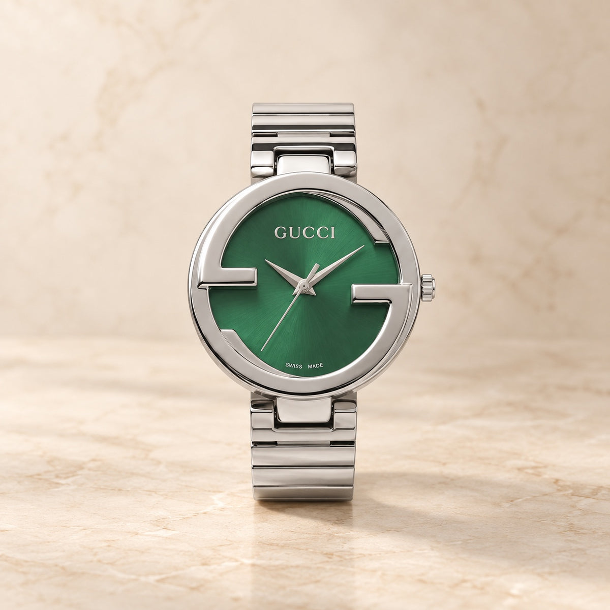 Silver round watch with green dial
